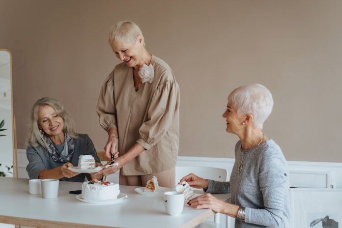 Photograph of Elderly Women Having a Birthday Celebration